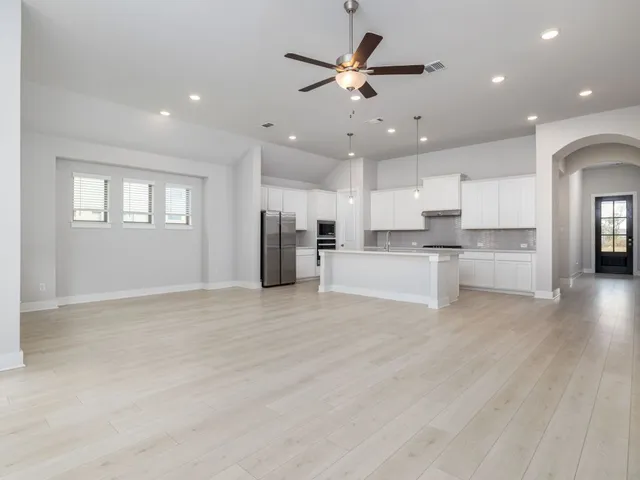 a view of kitchen with wooden floor and window
