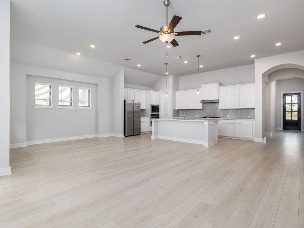 416 Ridgewell Loop Georgetown, TX 78633 - Photo 2 of 19 a view of kitchen with wooden floor and window