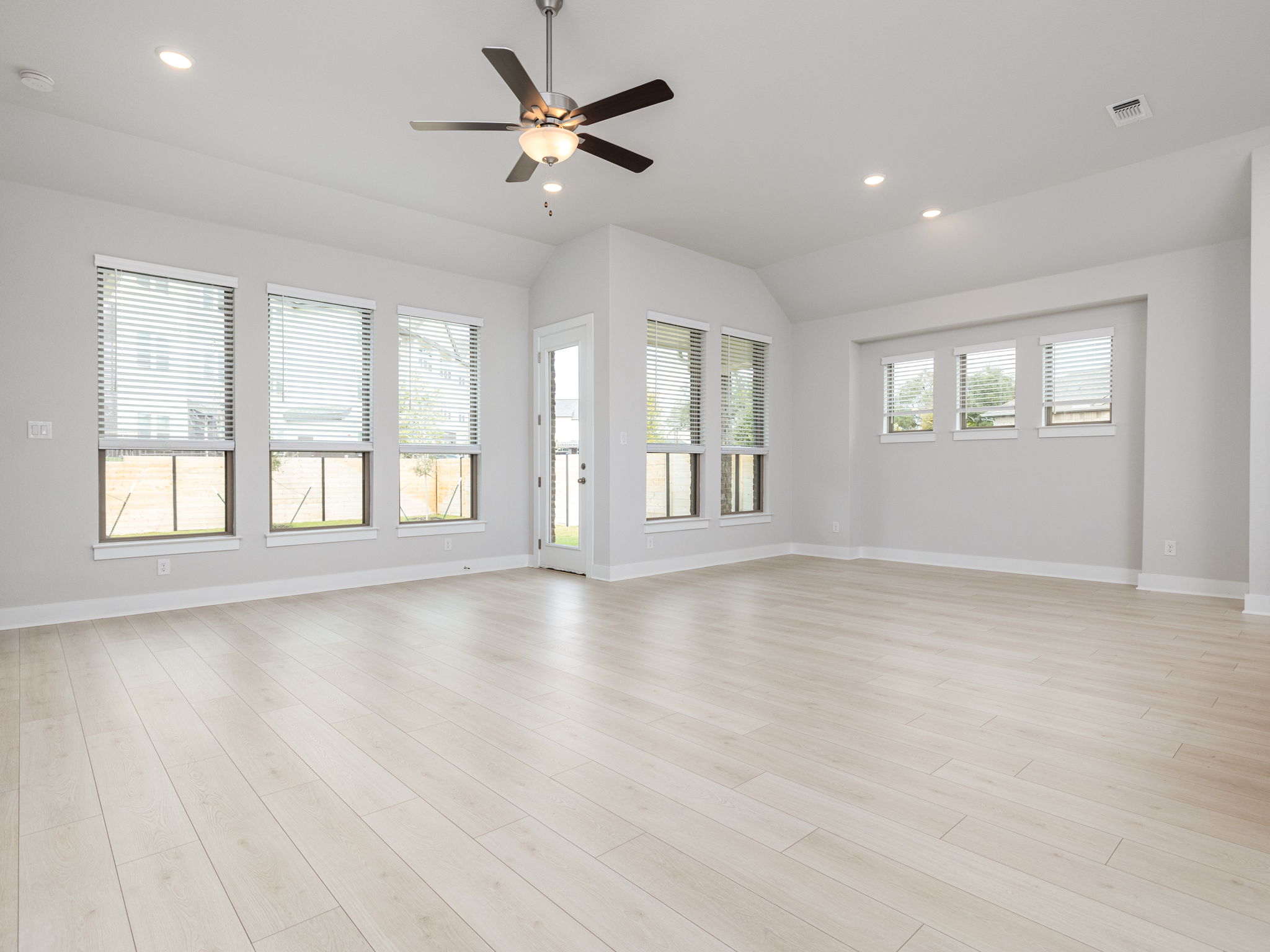 416 Ridgewell Loop Georgetown, TX 78633 - Photo 3 of 19 a view of an empty room with wooden floor and a window