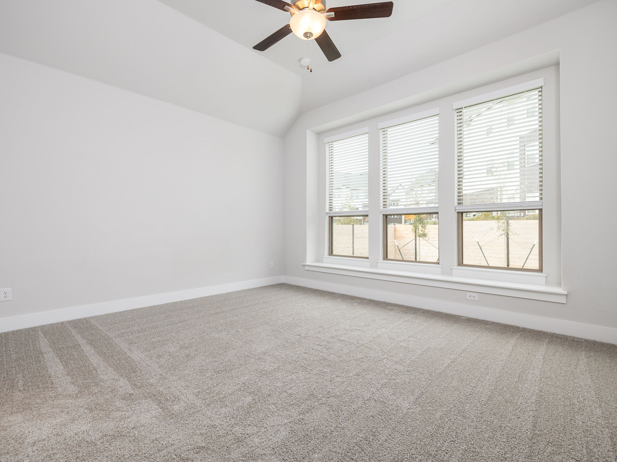 416 Ridgewell Loop Georgetown, TX 78633 - Photo 9 of 19 an empty room with a window and a ceiling fan