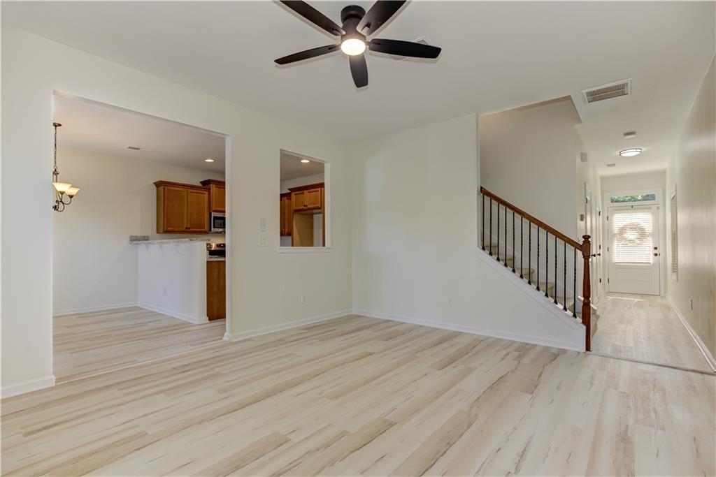 605 Summit Point Canton, GA 30114 - Photo 14 of 56 a view of a hallway with wooden floor and staircase