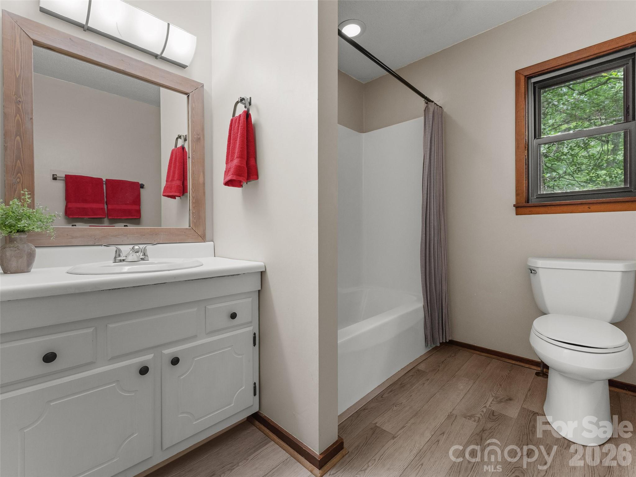 32 Honey Suckle Ridge Road Pisgah Forest, NC 28768 - Photo 23 of 35 a bathroom with a sink toilet and shower