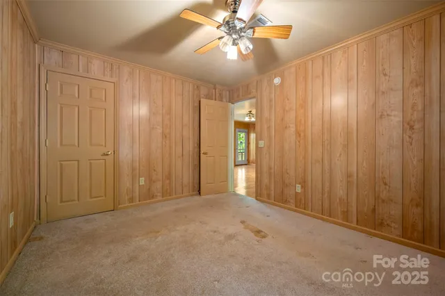 a view of a livingroom with a chandelier fan