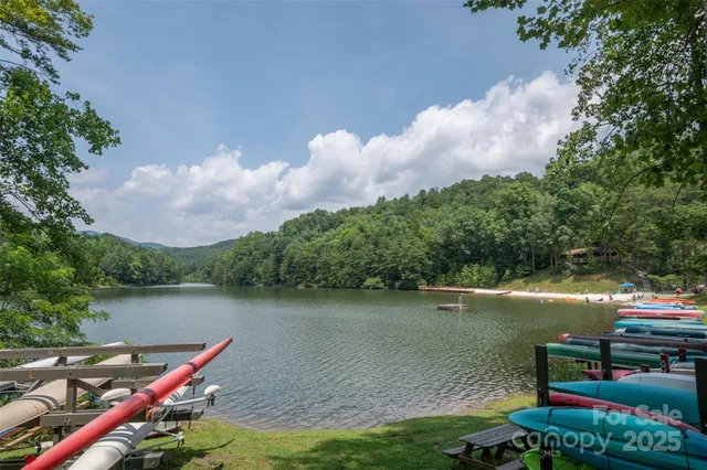 a view of a lake with a wooden deck and a lake view