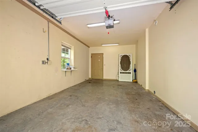 a view of a livingroom with a ceiling fan and window