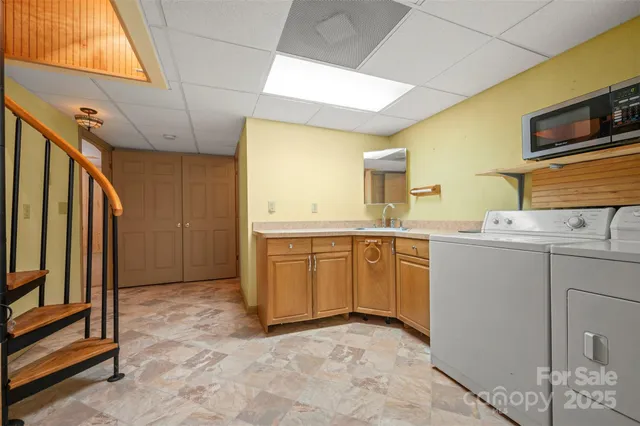 a view of a kitchen with a sink