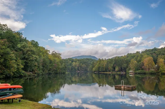 a view of a lake with sitting area and lake view