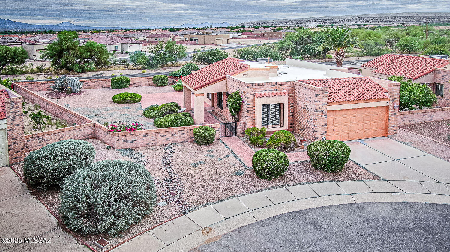 931 West Rio Guaymas Green Valley, AZ 85614 - Photo 1 of 39 a front view of a house with garden