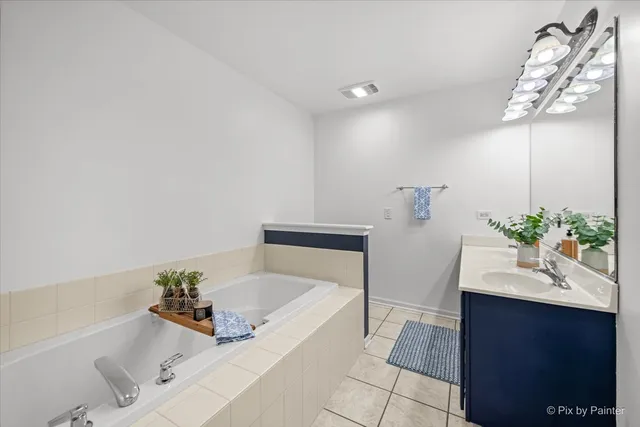 a bathroom with a bathtub and a sink