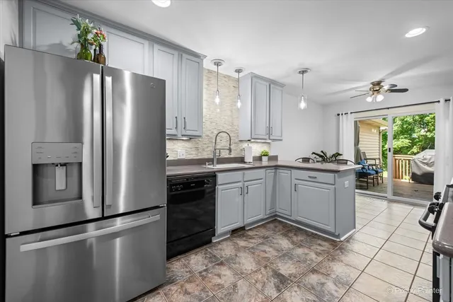 a kitchen with a refrigerator and a sink