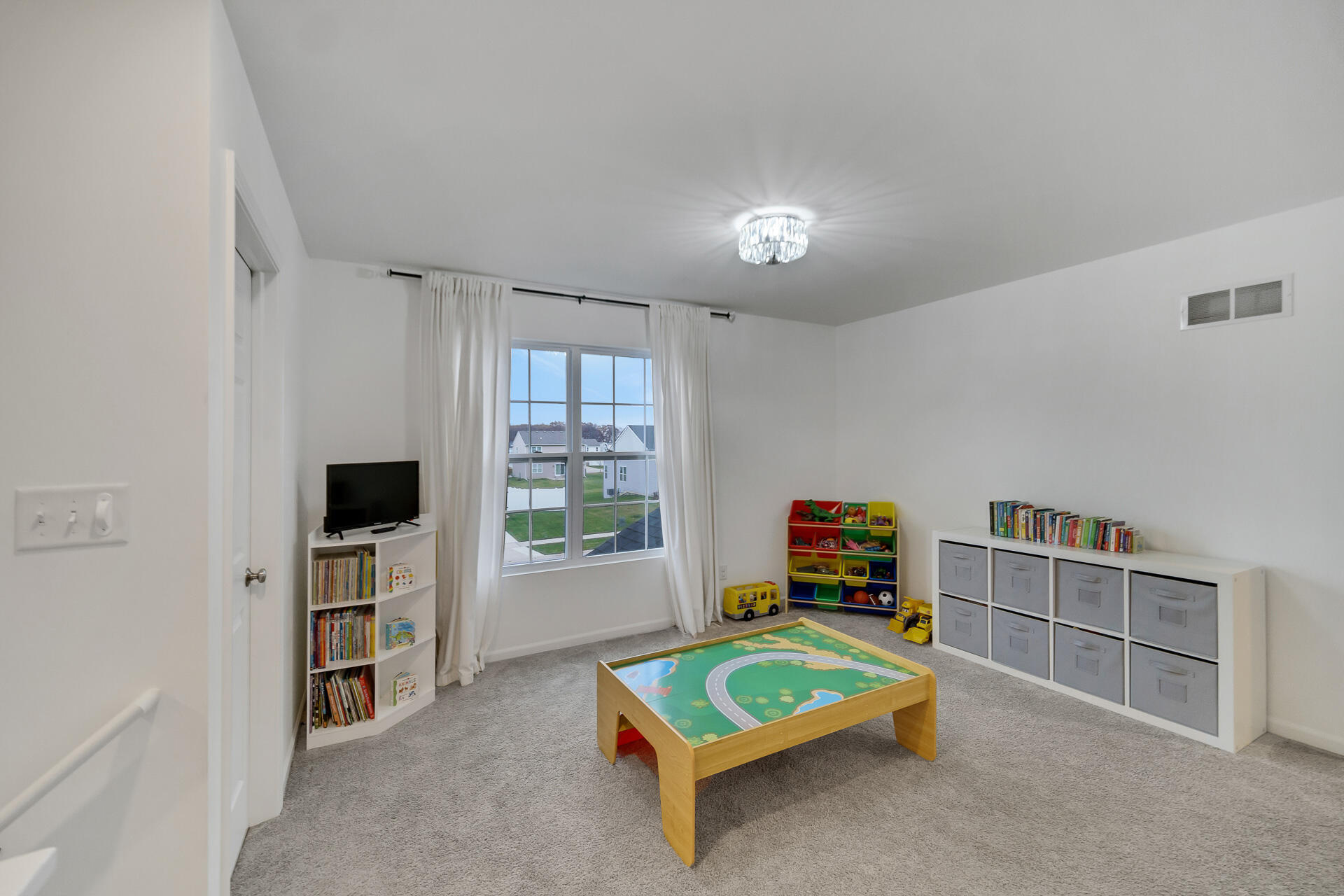 7375 East 120th Place Crown Point, IN 46307 - Photo 16 of 38 a living room with furniture and a flat screen tv