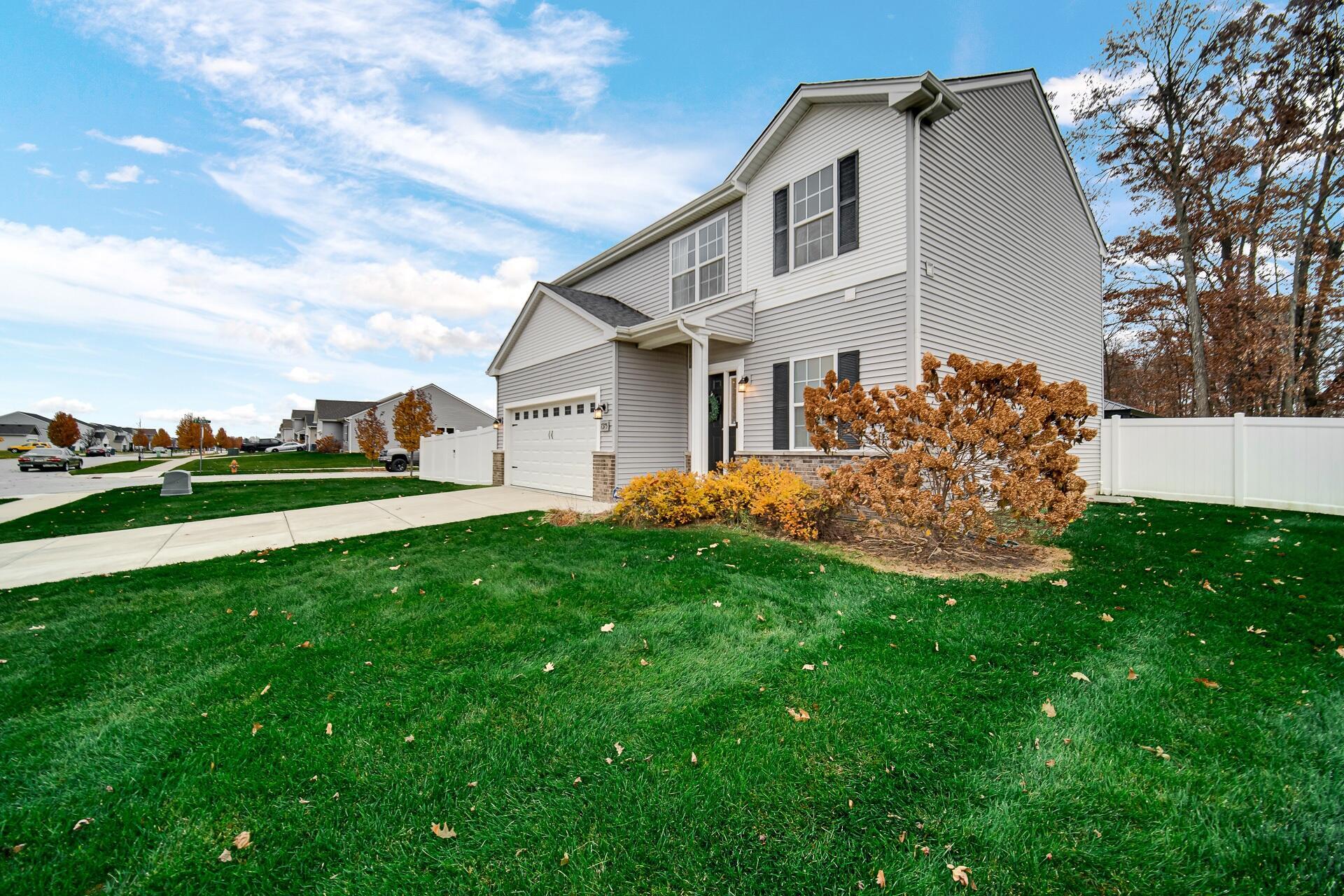 7375 East 120th Place Crown Point, IN 46307 - Photo 2 of 38 a front view of a house with a yard
