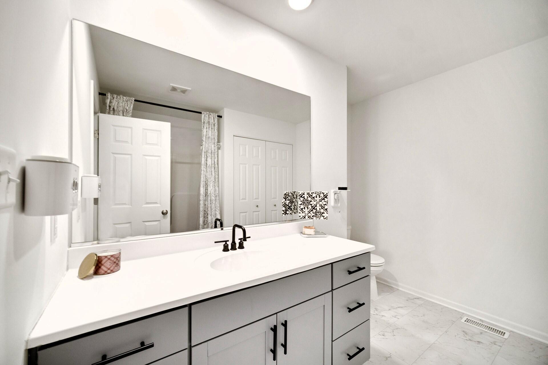 7375 East 120th Place Crown Point, IN 46307 - Photo 21 of 38 a bathroom with a sink and a mirror