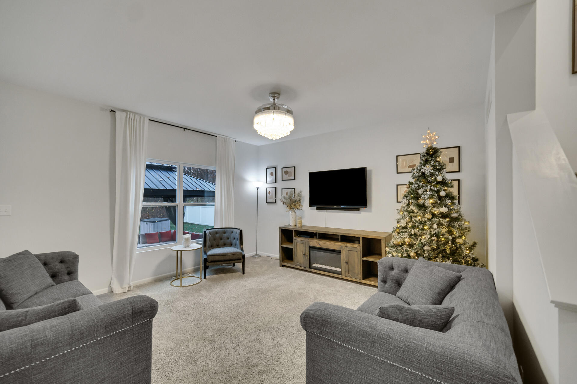 7375 East 120th Place Crown Point, IN 46307 - Photo 4 of 38 a living room with furniture and a flat screen tv