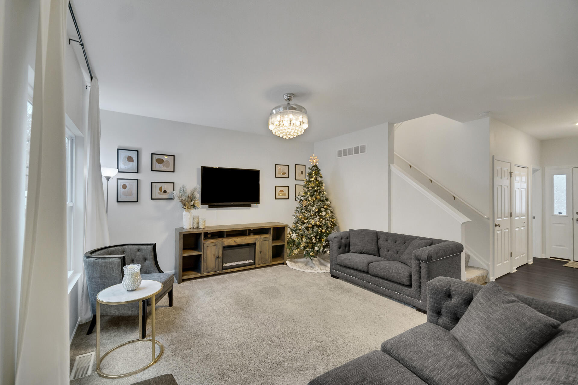 7375 East 120th Place Crown Point, IN 46307 - Photo 5 of 38 a living room with furniture and a flat screen tv