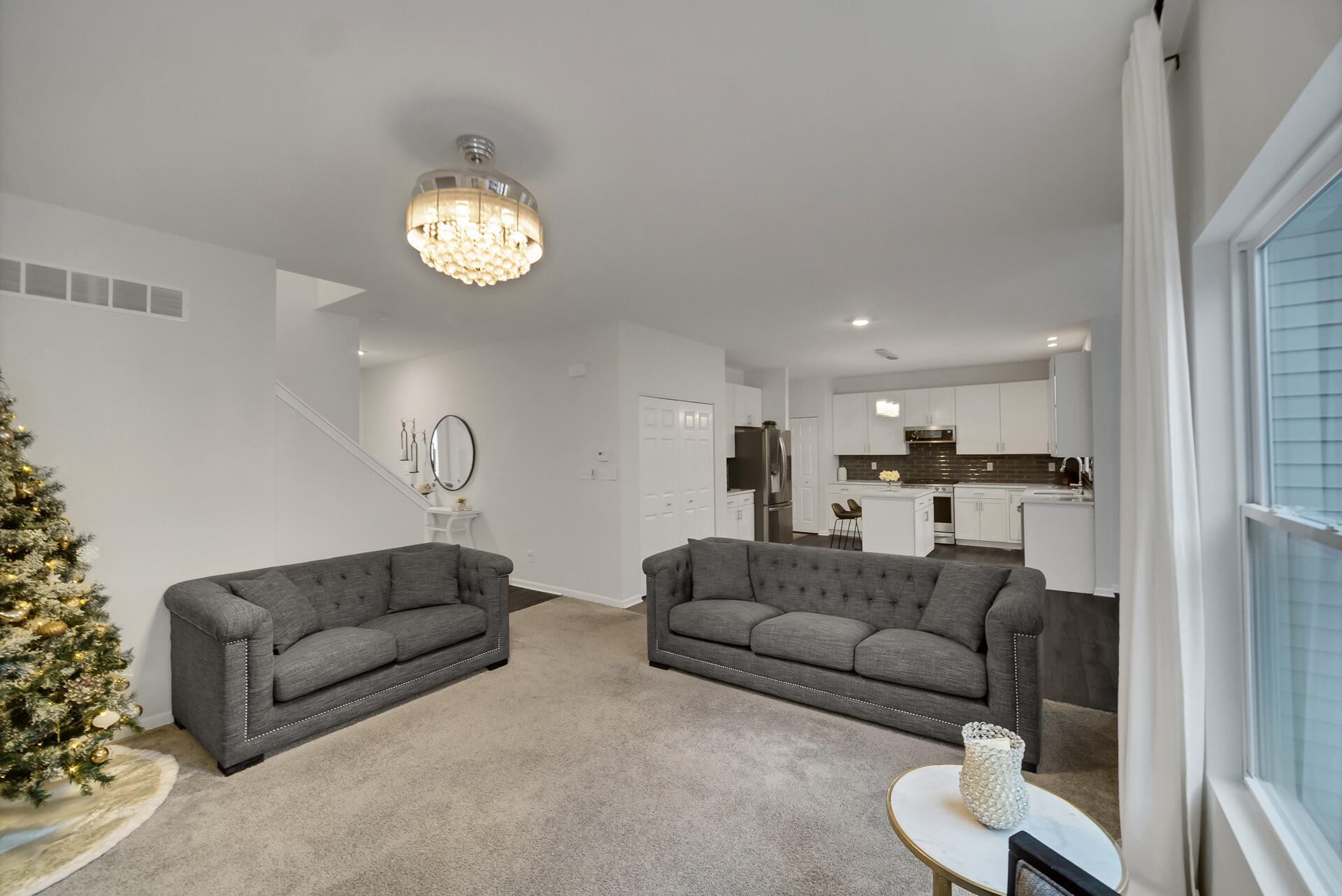 7375 East 120th Place Crown Point, IN 46307 - Photo 6 of 38 a living room with furniture kitchen view and a window