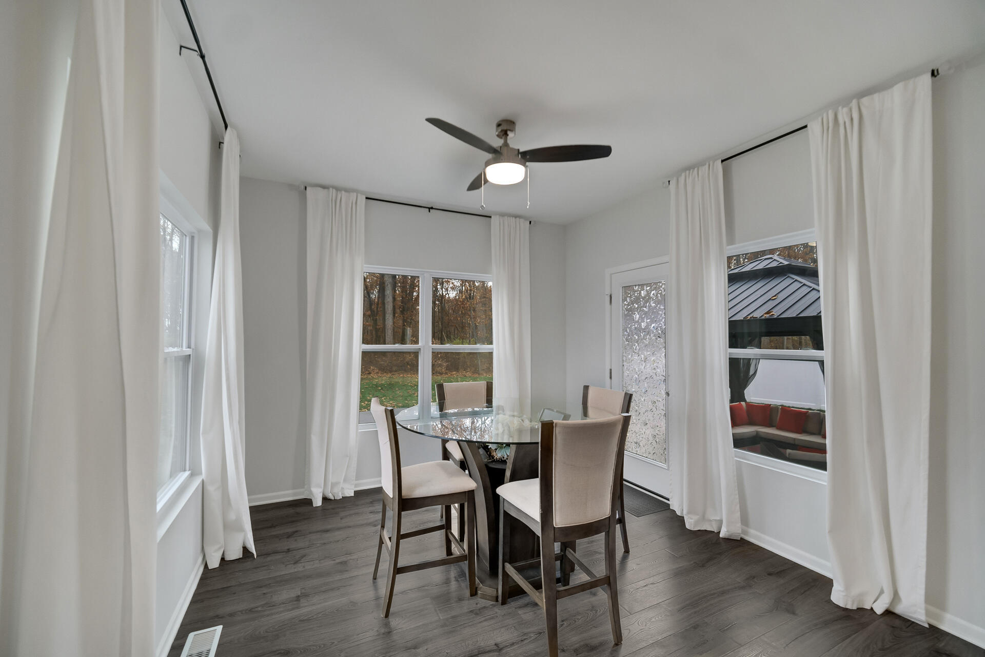 7375 East 120th Place Crown Point, IN 46307 - Photo 10 of 38 a view of a dining room with furniture window and wooden floor