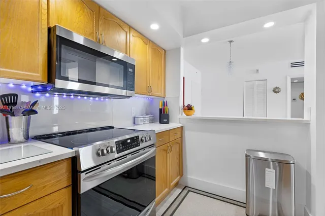 a kitchen with a stove and a microwave