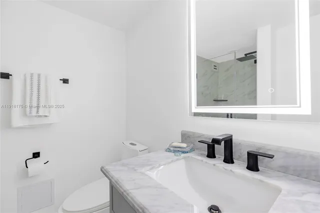 a bathroom with a sink and a toilet