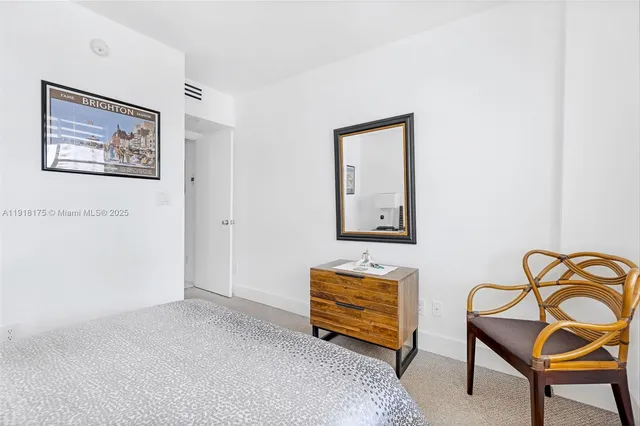 a room with furniture and paintings on the wall