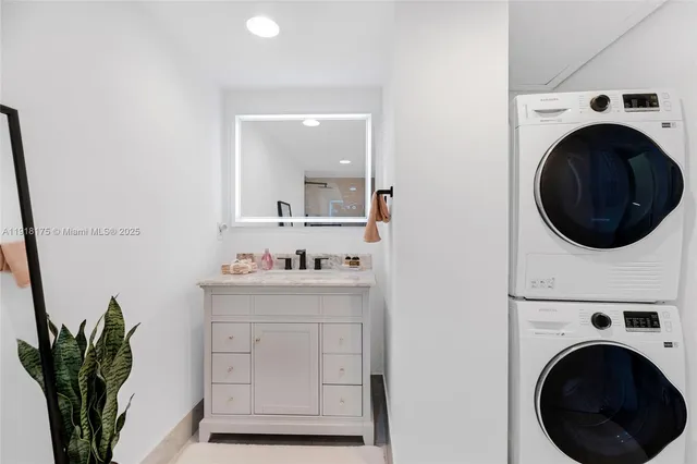 a view of a hallway with washer and dryer