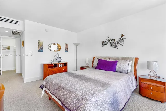 a bedroom with bed and window