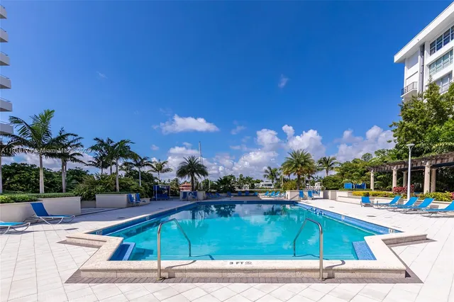 a view of a swimming pool with a patio