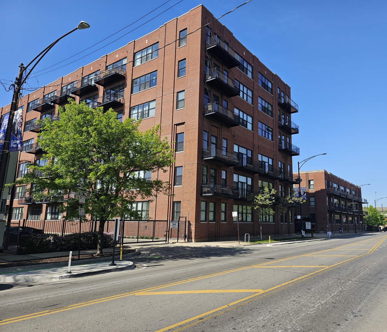 2323 West Pershing Road, Unit 128 Chicago, IL 60609 - Photo 1 of 9 a view of a building and a street