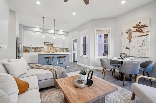 a living room with furniture and a table