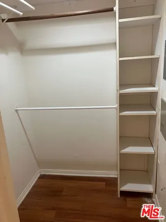 a view of an empty walk in closet