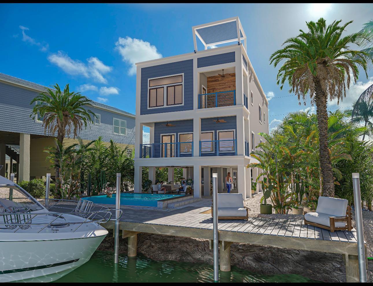 662 Blackbeard Road Summerland Key, FL 33042 - Photo 1 of 32 a front view of a house with porch and yard