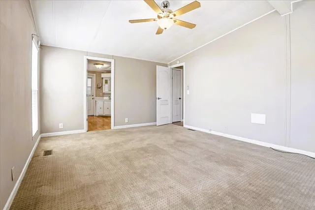 a view of a kitchen with wooden floor