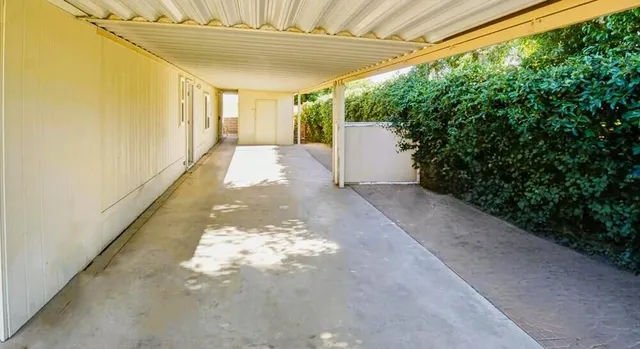 a view of a house with a backyard and garden