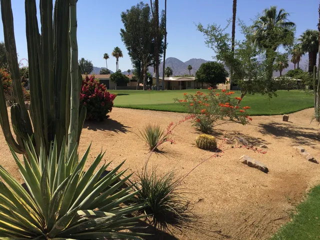 a view of a house with backyard