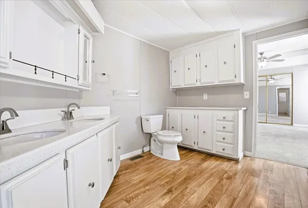 a white bath tub sitting next to a window