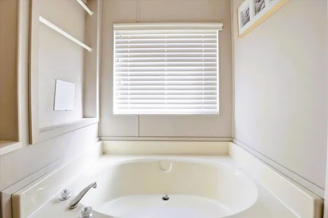 a view of a swimming pool with chairs