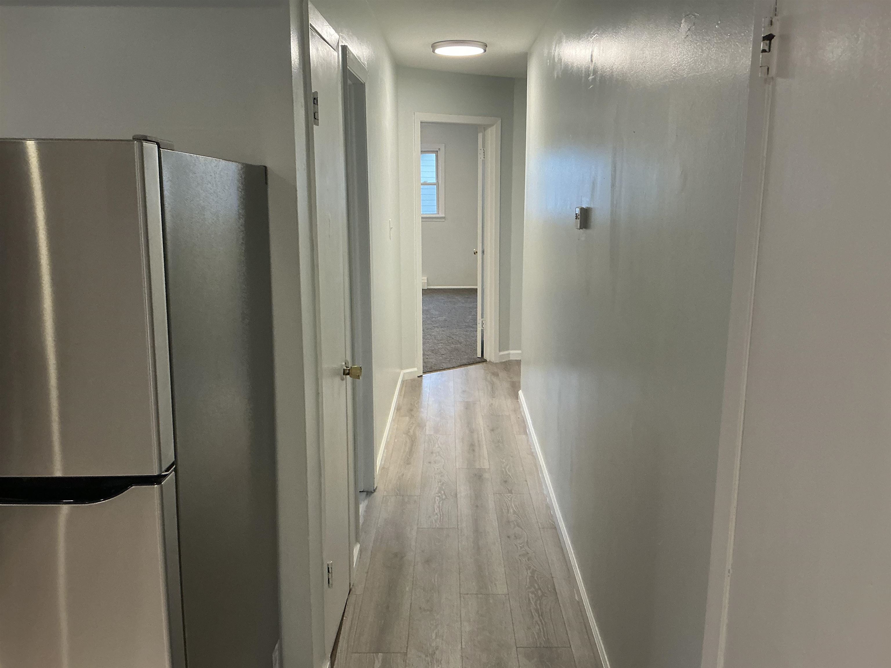 10 West Grand Street, Unit 2 Bayonne, NJ 07002 - Photo 13 of 13 a view of a hallway with wooden floor