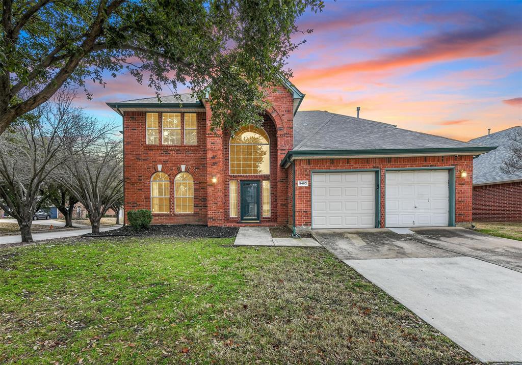 5460 Glen Canyon Road Fort Worth, TX 76137 - Photo 1 of 1 a front view of a house with a yard and garage