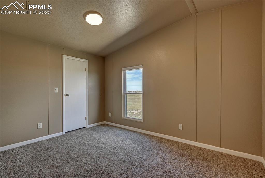 33115 Torrence Road Yoder, CO 80864 - Photo 16 of 50 an empty room with windows and closet