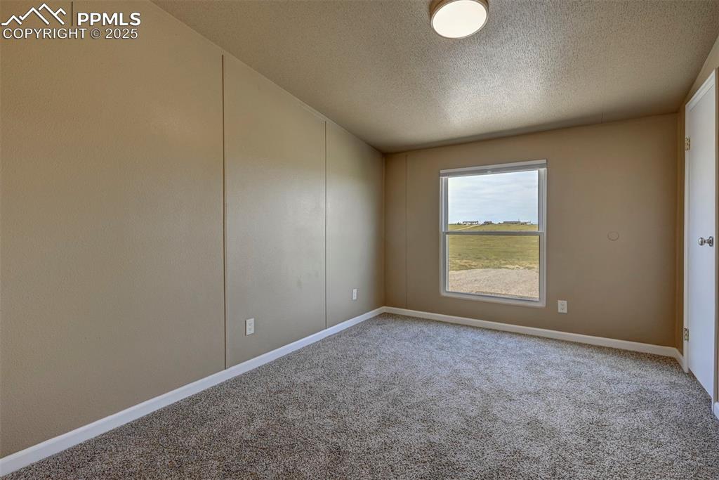 33115 Torrence Road Yoder, CO 80864 - Photo 17 of 50 an empty room with windows