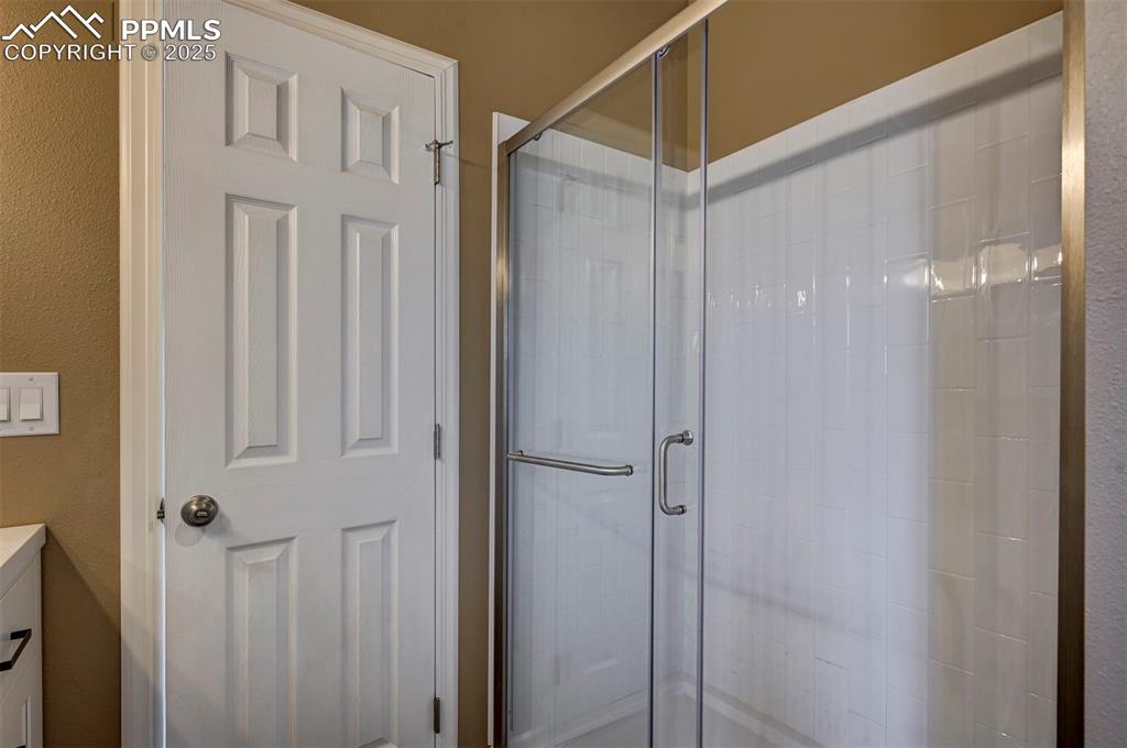 33115 Torrence Road Yoder, CO 80864 - Photo 26 of 50 a bathroom with a glass shower door