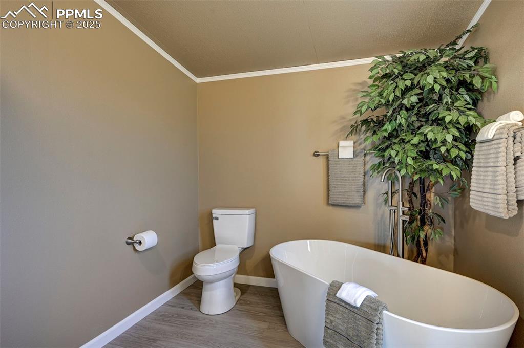 33115 Torrence Road Yoder, CO 80864 - Photo 29 of 50 a white toilet sitting next to a shower