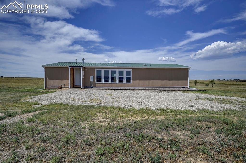 33115 Torrence Road Yoder, CO 80864 - Photo 32 of 50 a view of a house with a backyard