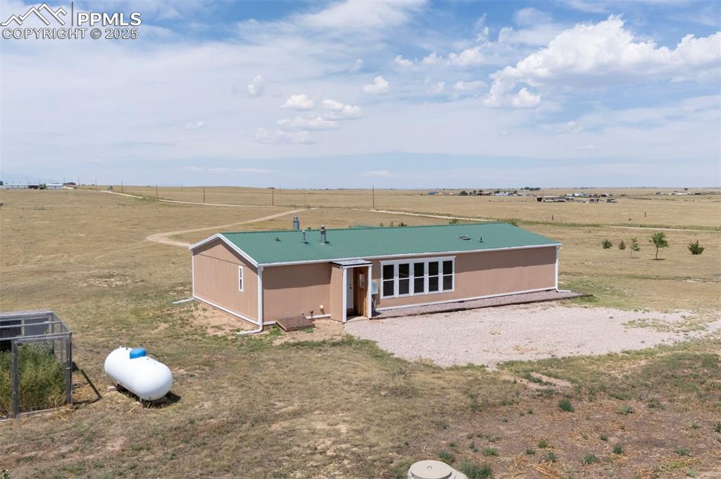 33115 Torrence Road Yoder, CO 80864 - Photo 35 of 50 a view of a terrace with a lake view