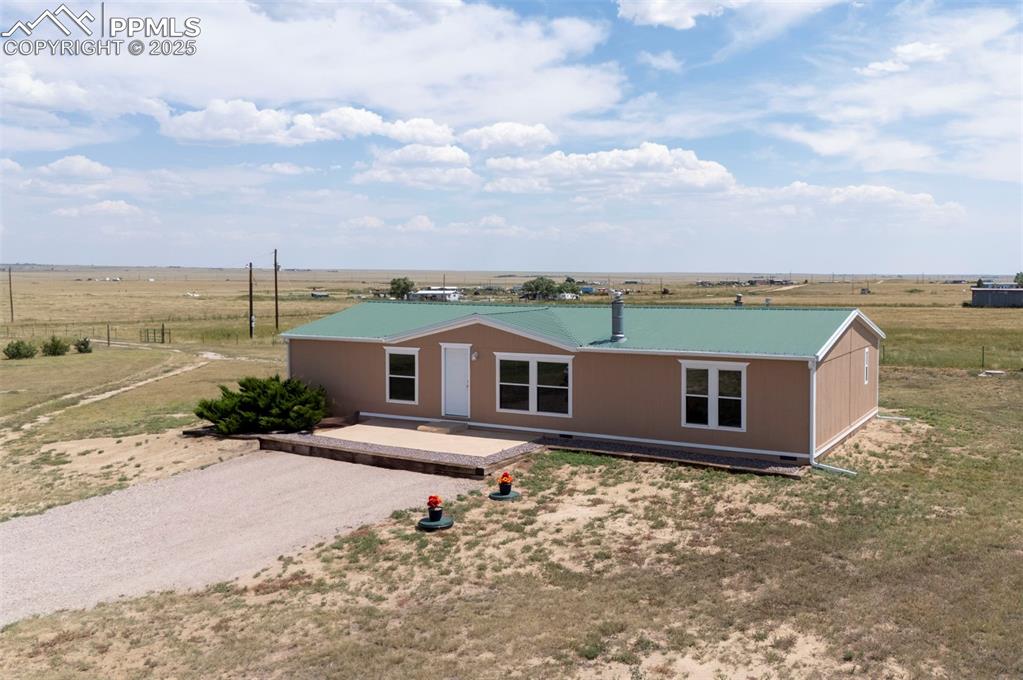 33115 Torrence Road Yoder, CO 80864 - Photo 36 of 50 a view of a house with yard and lake view