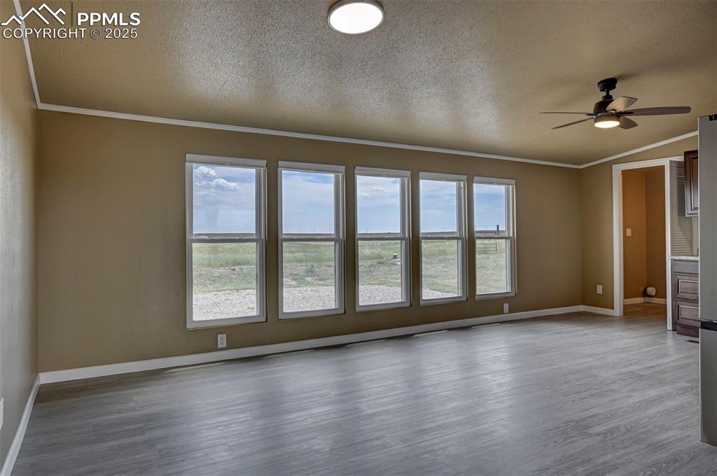 33115 Torrence Road Yoder, CO 80864 - Photo 7 of 50 wooden floor in an empty room with a window
