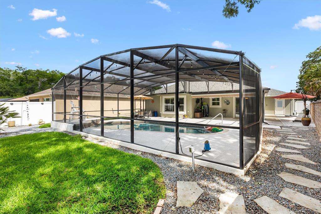 7351 Southeast 169th Cote Loop The Villages, FL 32162 - Photo 23 of 32 a view of a backyard with a garden