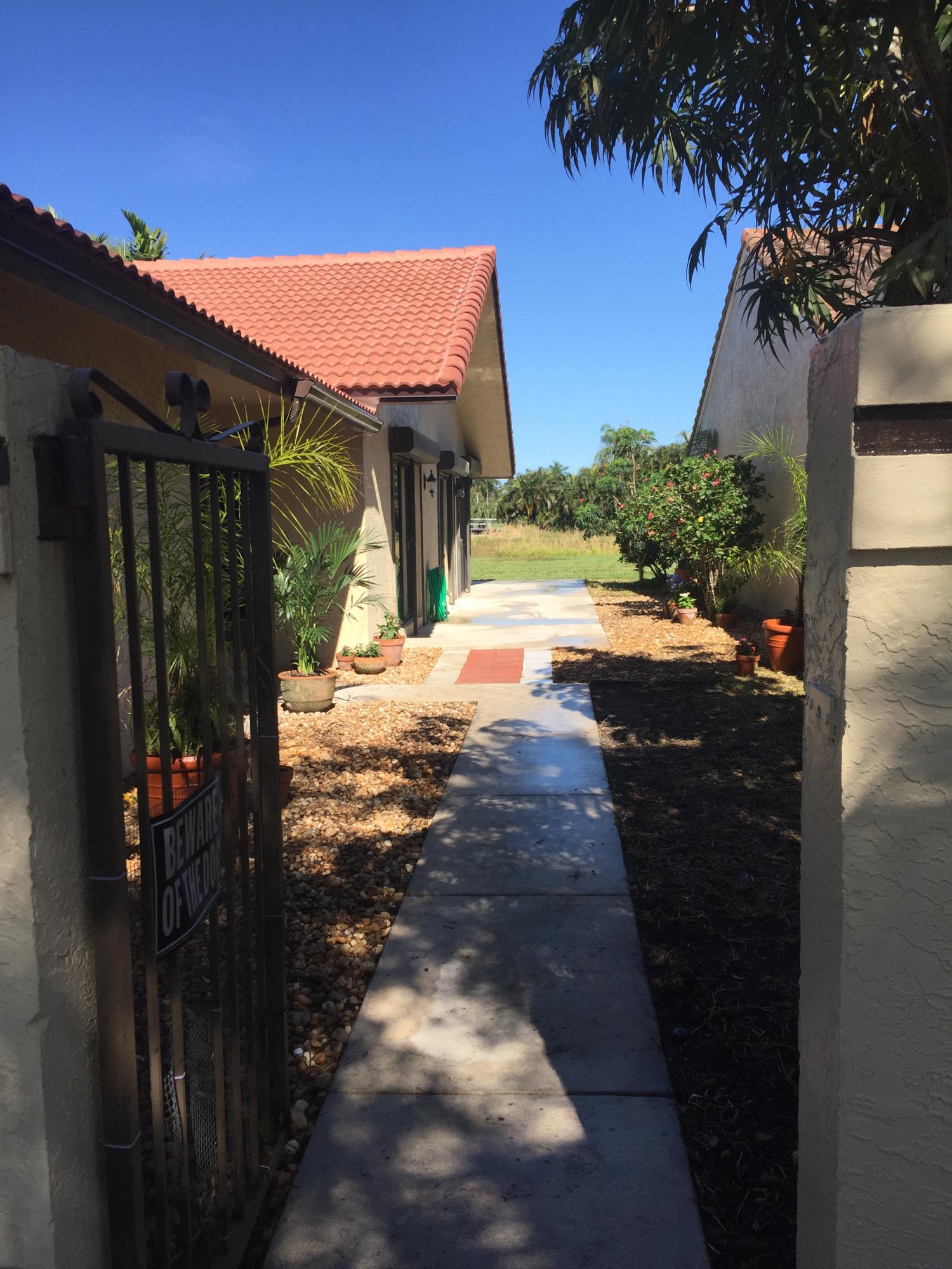 2115 Northwest 18th Street Delray Beach, FL 33445 - Photo 2 of 11 side yard ne 18th st