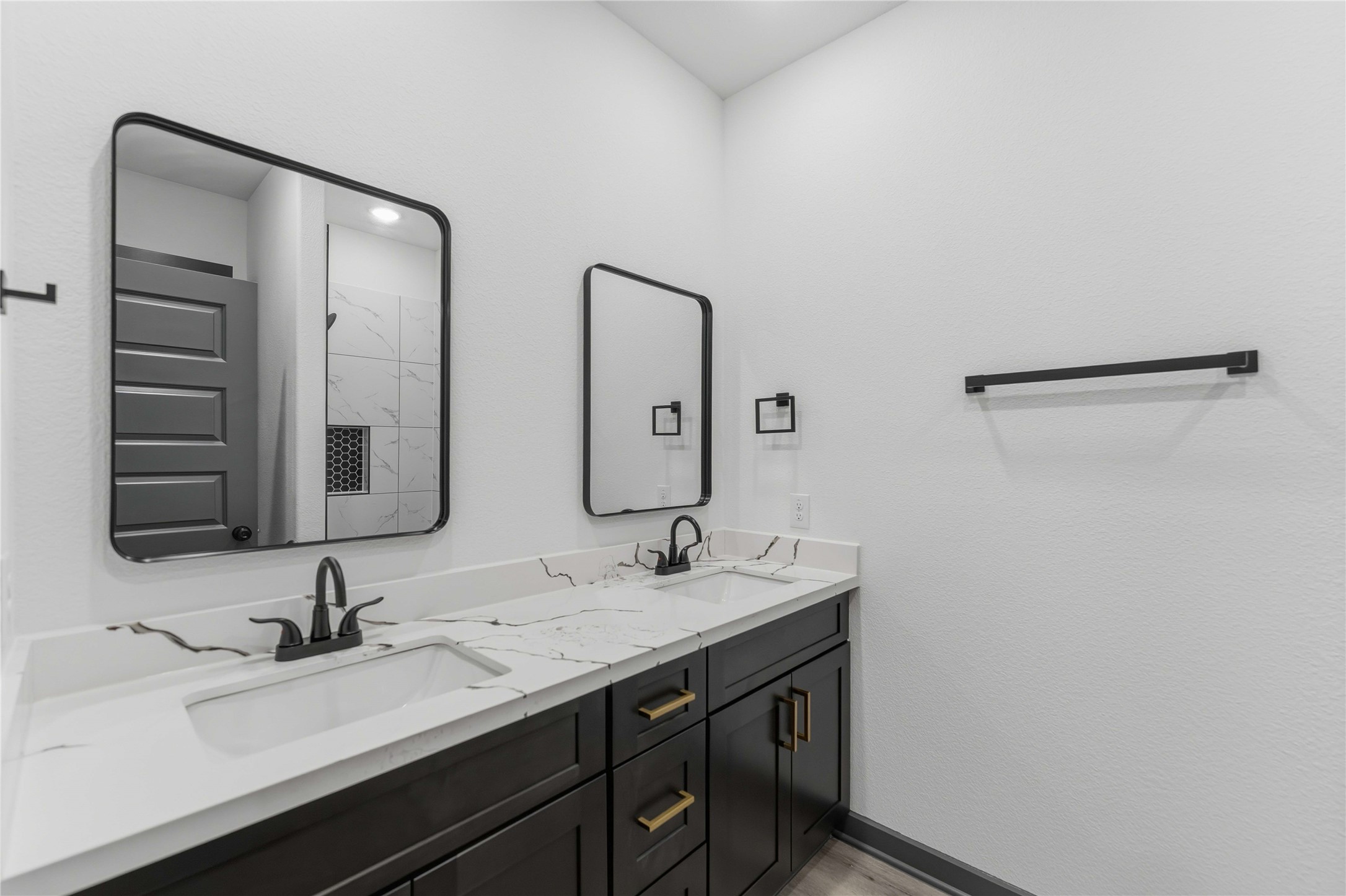 8006 Birmingham Street, Unit A/B Houston, TX 77028 - Photo 13 of 24 a bathroom with 2 sink and a mirror