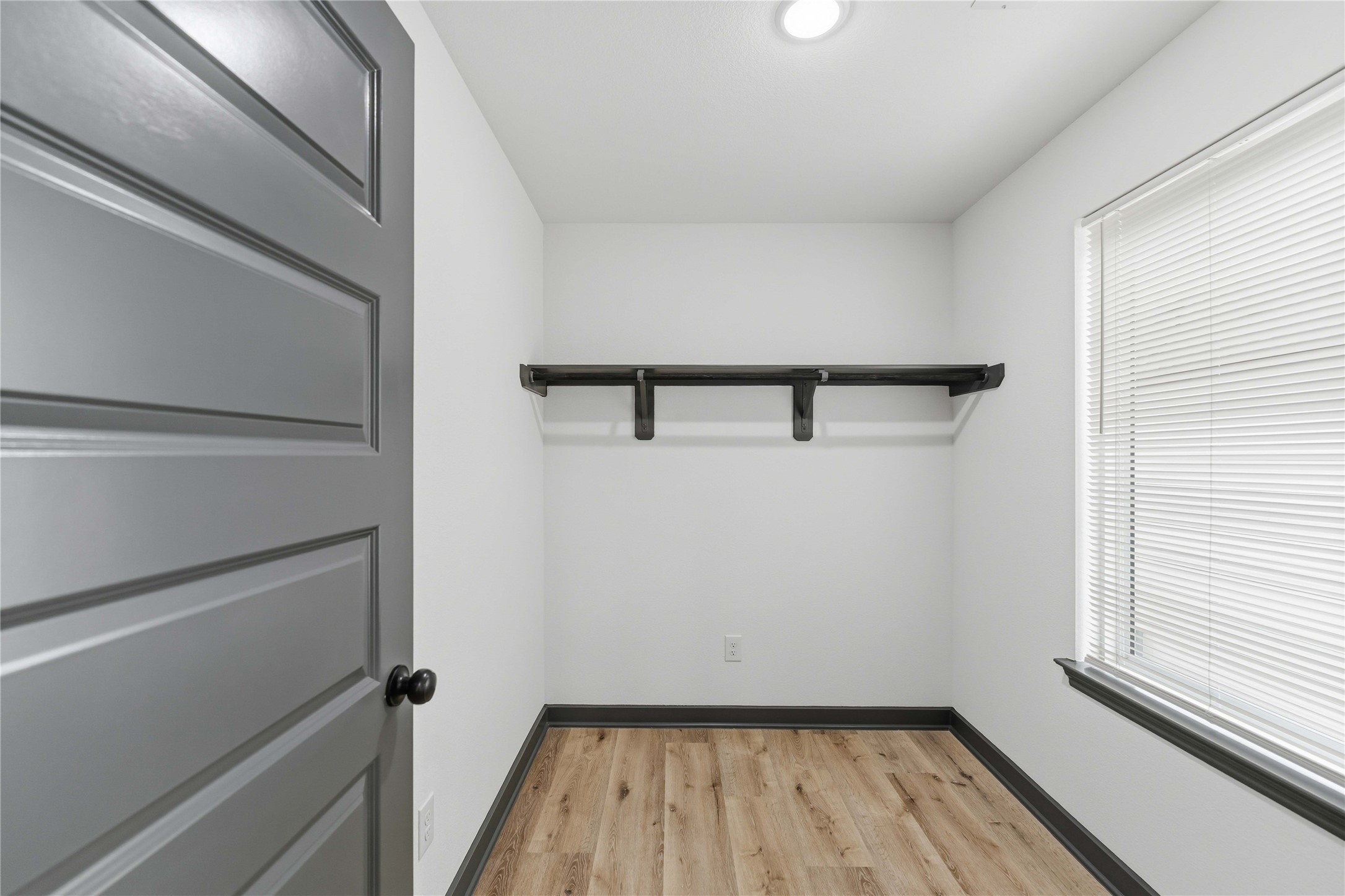 8006 Birmingham Street, Unit A/B Houston, TX 77028 - Photo 16 of 24 a view of a room with wooden floor and small window